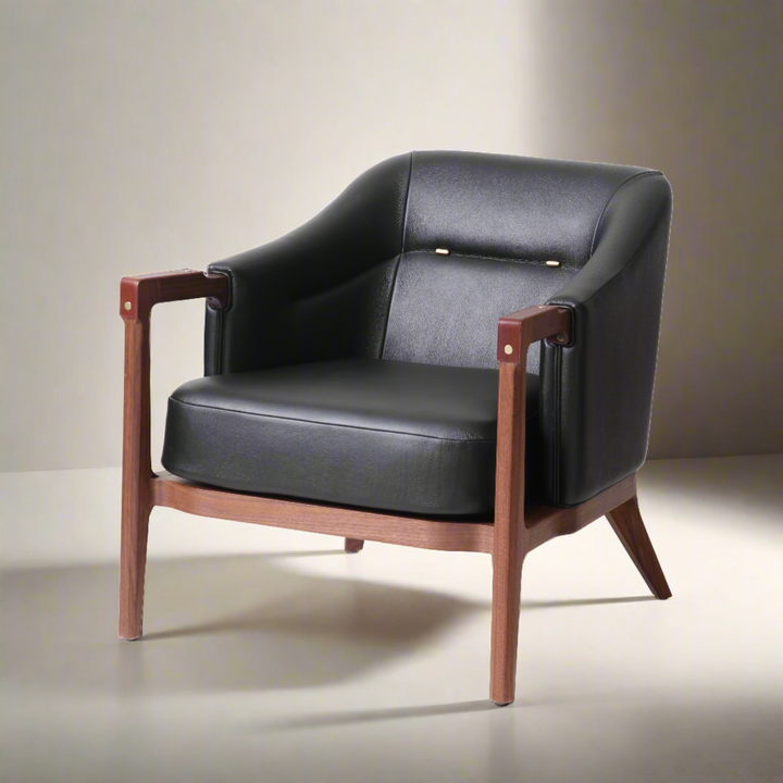 Modern lounge chair with natural walnut wooden frame, black leather upholstery, and brass details, perfect for contemporary living rooms or stylish office spaces.